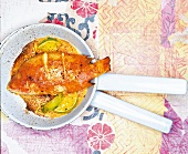 Red snapper with peanut sauce in frying pan