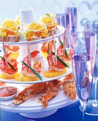 Tete de Moine cheese, shrimp and turkey appetizers on tiered stand