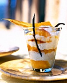 Close-up of rice pudding with apricot compote in glass