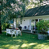 Exterior of house with wooden roofs and garden