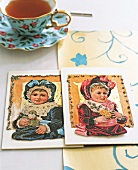 Two nostalgic cards decorated with gold leaf and glitter paste