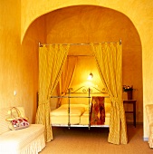 Cosy bedroom and sofa in yellow colour