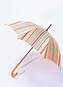 Striped umbrella on white background