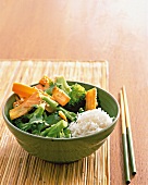Asian vegetables with rice in bowl