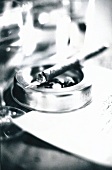 Close-up of cigar on ashtray, black and white