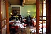 People sitting in restaurant at Chateau de la Pomarede, France