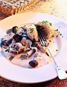 Mushroom ragout with bread dumplings on plate