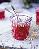 A glass of strawberry and elderflower jam