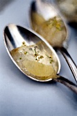 Close-up of elderflower jelly on tablespoon