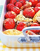 Close-up of chicken vermouth with tomatoes in baking dish