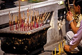 People praying at Buddhist temple