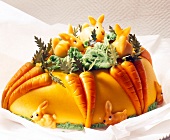 Easter cake decorated with marzipan carrots and hasen