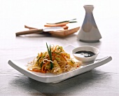 Crispy fried noodles with vegetables and pineapple on plate
