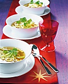 Lemon grass soup with coriander pancake in bowls