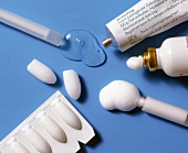 Various chemical contraceptives on blue background