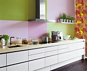 Modern kitchen with drawers and rose wallpaper