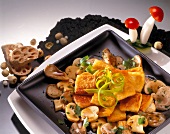 Fried tofu with oyster mushrooms on dish, Euro-Asian cuisine