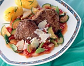 Beef fillet with tomato, zucchini and vegetables on plate