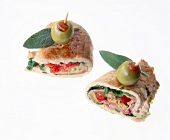 Appetizer of cutlet with bacon, mozzarella and olives on white background