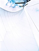 Low angle view of white sail overlooking the sky