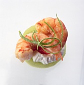 Close-up of kiwi with shrimp and sour cream on white background