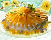 Easter cake with mango and small Easter eggs on plate