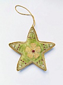 Close-up of Christmas star decoration on white background
