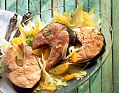 Salmon with fennel and oranges on plate