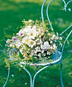 Bridal bouquet on chair in garden