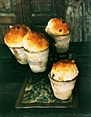 Four panettone in clay pots