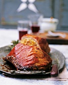 Stuffed breast of lamb with dried fruit and ricotta on plate