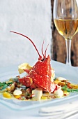 Lobster with mango dip and artichokes on plate