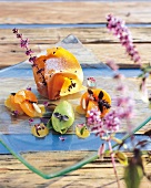 Apricot and basil on glass plate