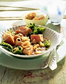 Poached salmon cubes with strips of savoy cabbage in bowl