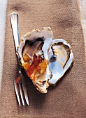 Oysters with bacon on brown cloth