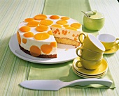 Peach ricotta pie with tea set and spatula