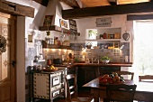 Antique kitchen with old stove and antique tiles in South of France