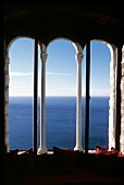 View of sea and sky from white antique columns window