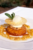 Close-up of dessert with roasted pineapple and coconut on plate