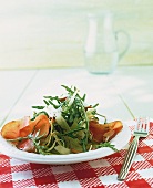 Arugula salad with bresaola on plate