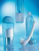 Close-up of modern skin cleansing products with a bluish tint