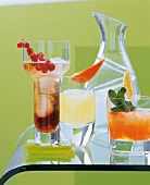 Cocktails against green background