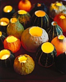 Close-up of lit candles in hollowed out pumpkins