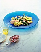 Green bean salad with salmon and tagliatelle on blue plate