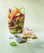 Salmon radicchio salad with pesto in glass