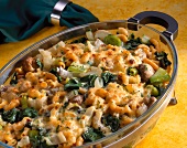 Baked pasta with swiss chard, leeks and mushrooms in serving tray