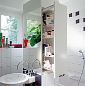 Larder unit with baskets and sink in bathroom