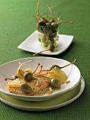 Turkey escalope with lemon and garlic on plate