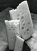Close-up of three different pieces of cheese