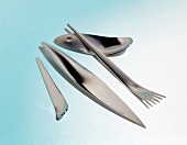 Designer cutlery on blue background